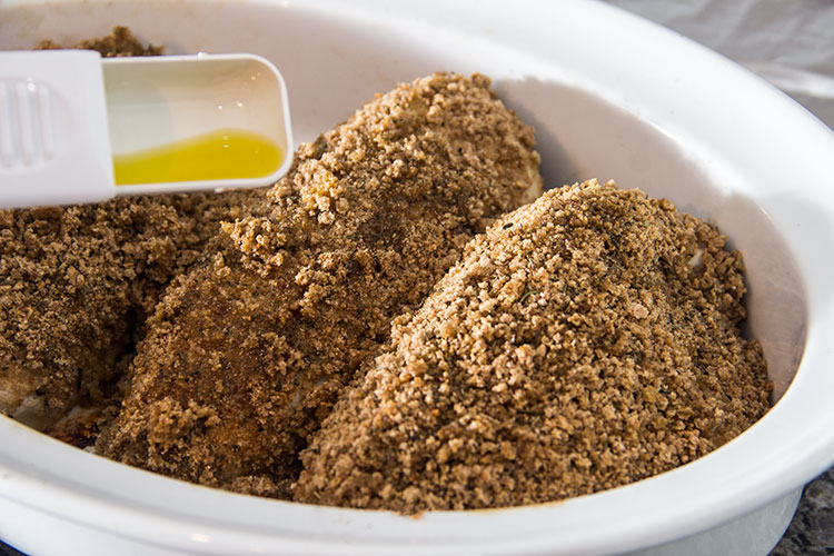 coating-breaded-chicken-with-oil