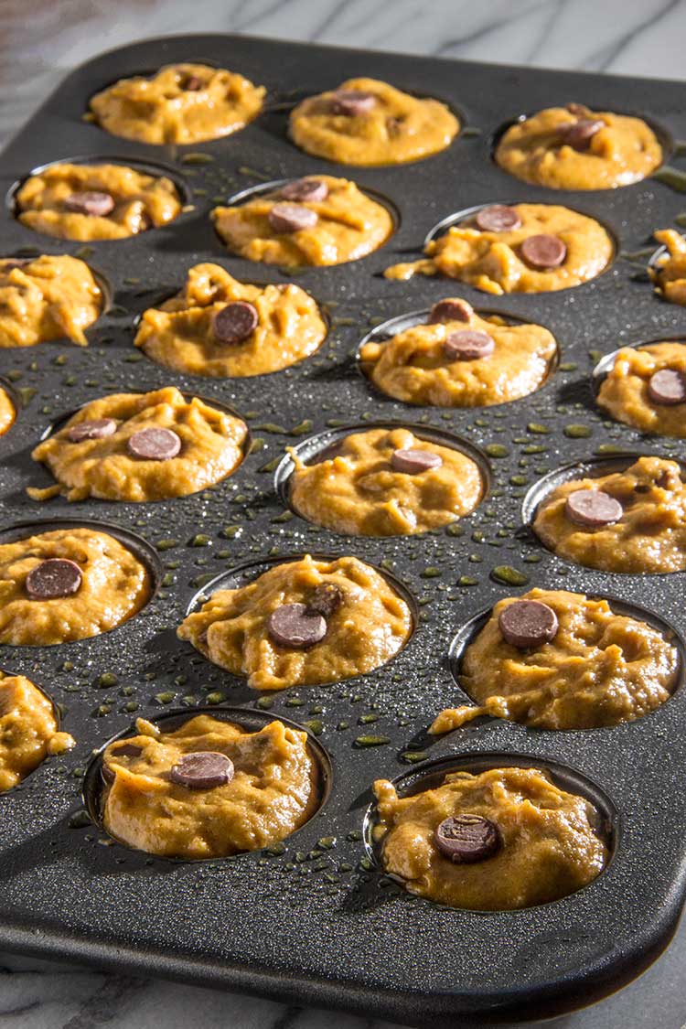 preparing-mini-chocolate-chip-pumpkin-muffins